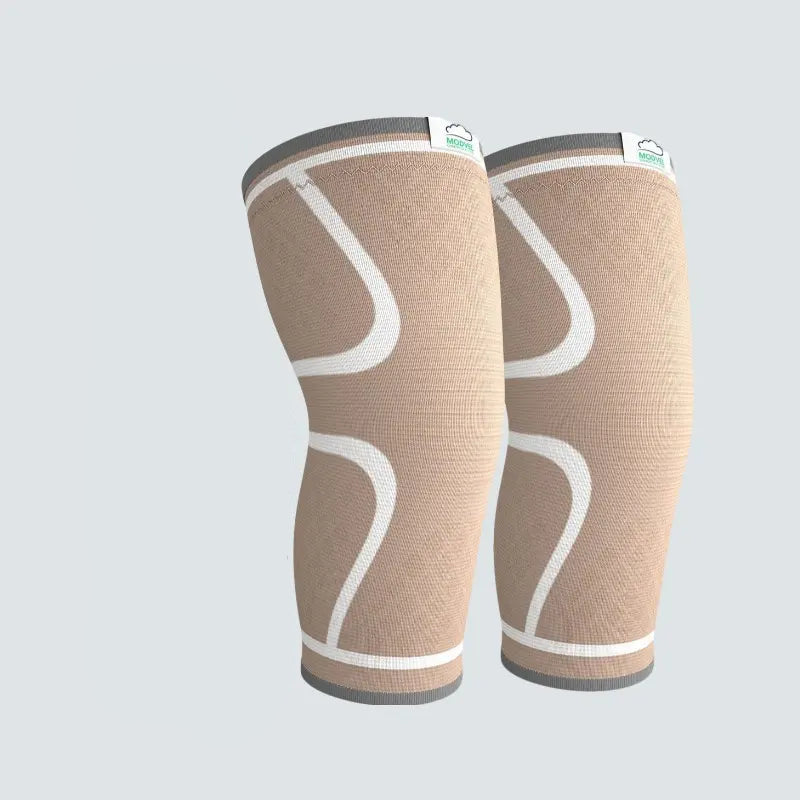 Beige knee sleeves with packaging on a light gray background