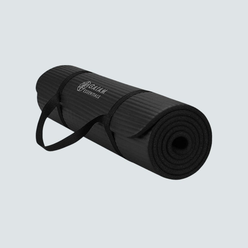 Black yoga mat with a brand logo on a light gray background