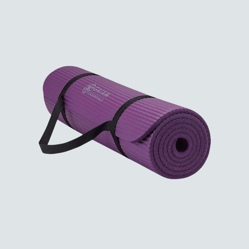 Purple yoga mat with a black strap on a light gray background
