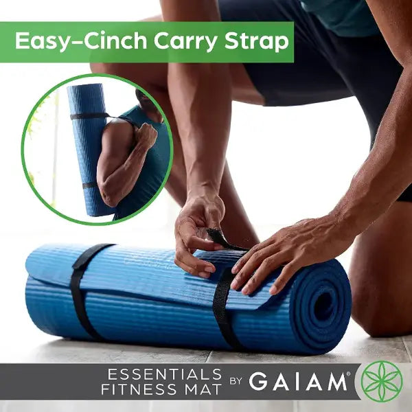 Person rolling up a blue fitness mat with an Easy-Cinch Carry Strap, Gaiam logo visible.