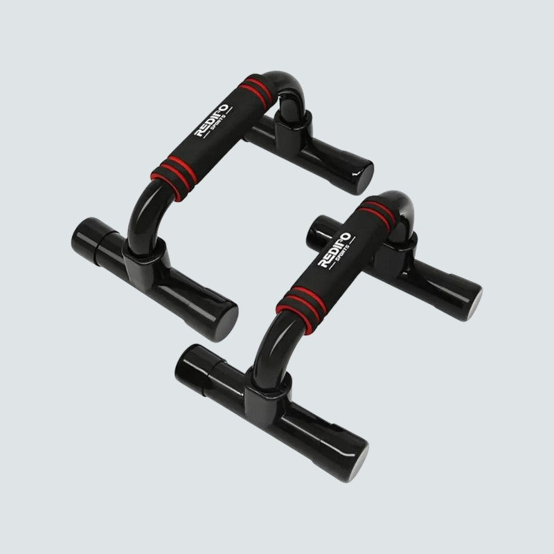 Black and red push-up bars on a light gray background