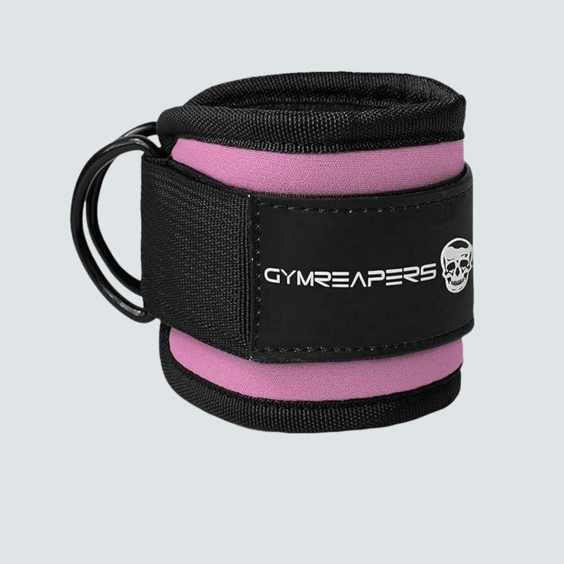 Pink and black wrist wrap with 'Gymreapers' branding on a light gray background