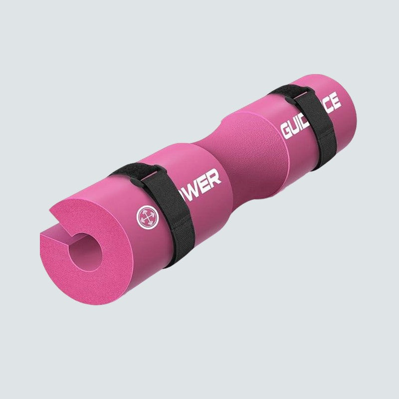 Pink exercise mat with black straps on a light gray background