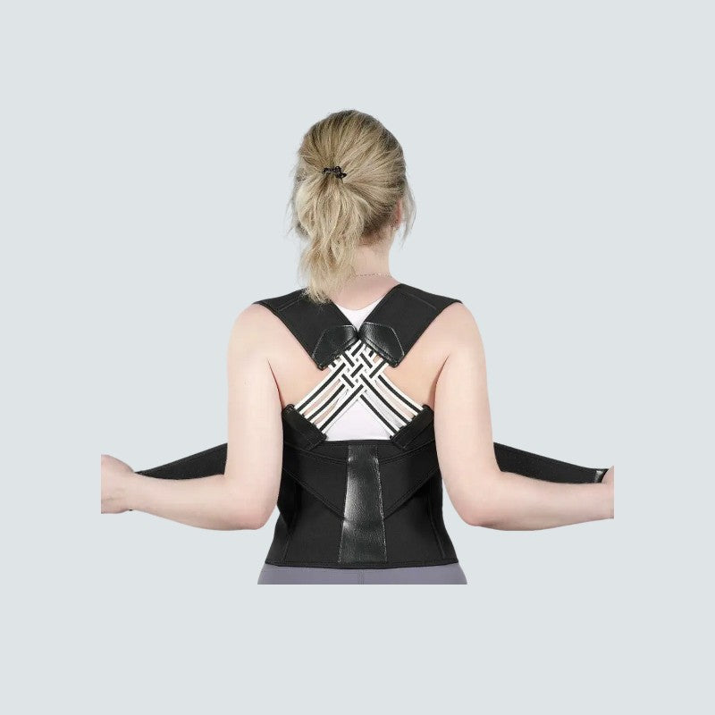 Person wearing a black back brace on a light gray background