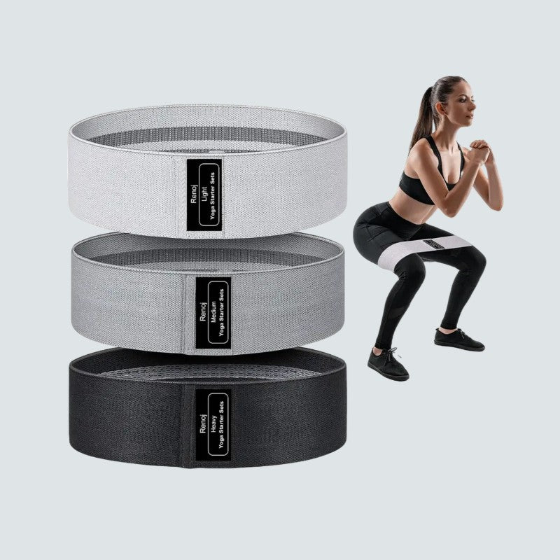 Three resistance bands stacked with a woman exercising on a light gray background