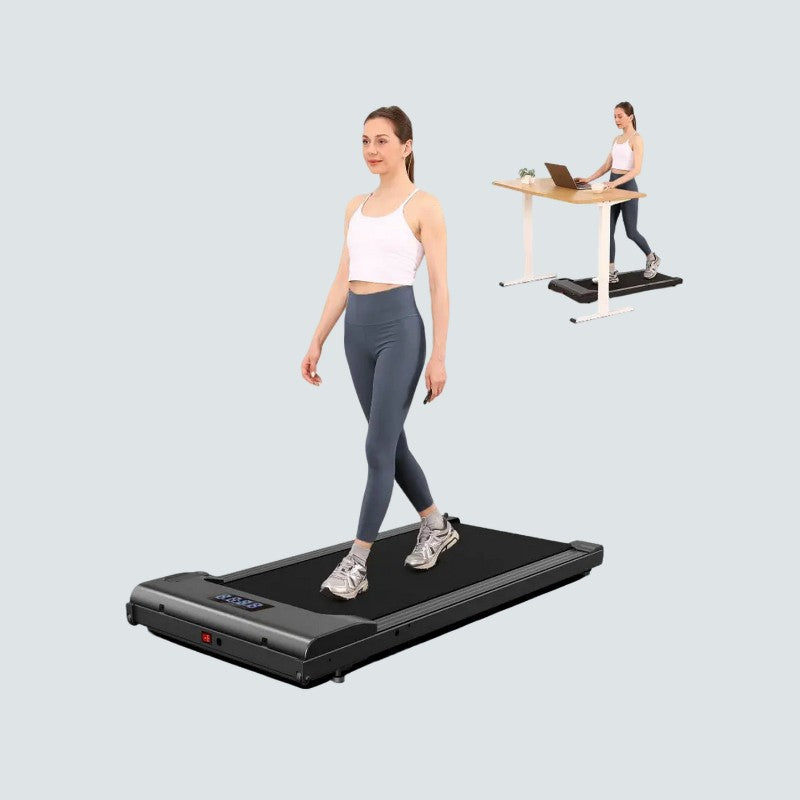 Woman using a treadmill on a light gray background