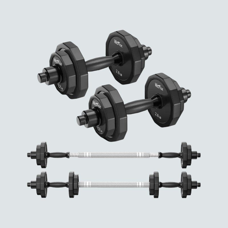 Set of adjustable dumbbells on a light gray background