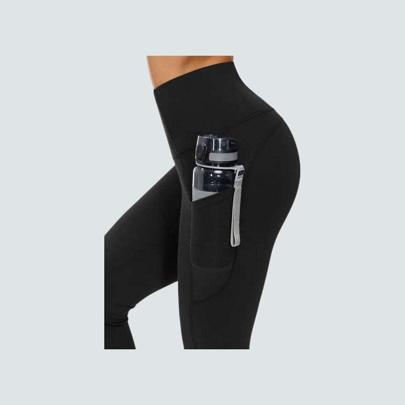 Black leggings with a pocket holding a water bottle on a light gray background